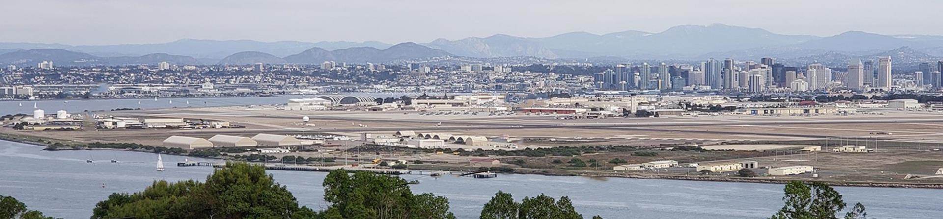East facing view of San Diego Skyline with distant mountains in background
