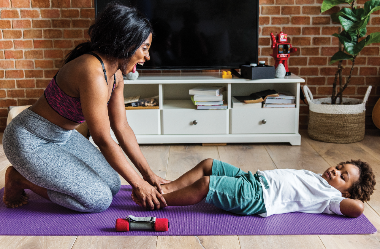 Mother and son exercising at home
