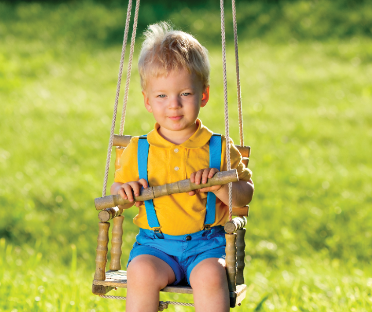 Toddler in swing